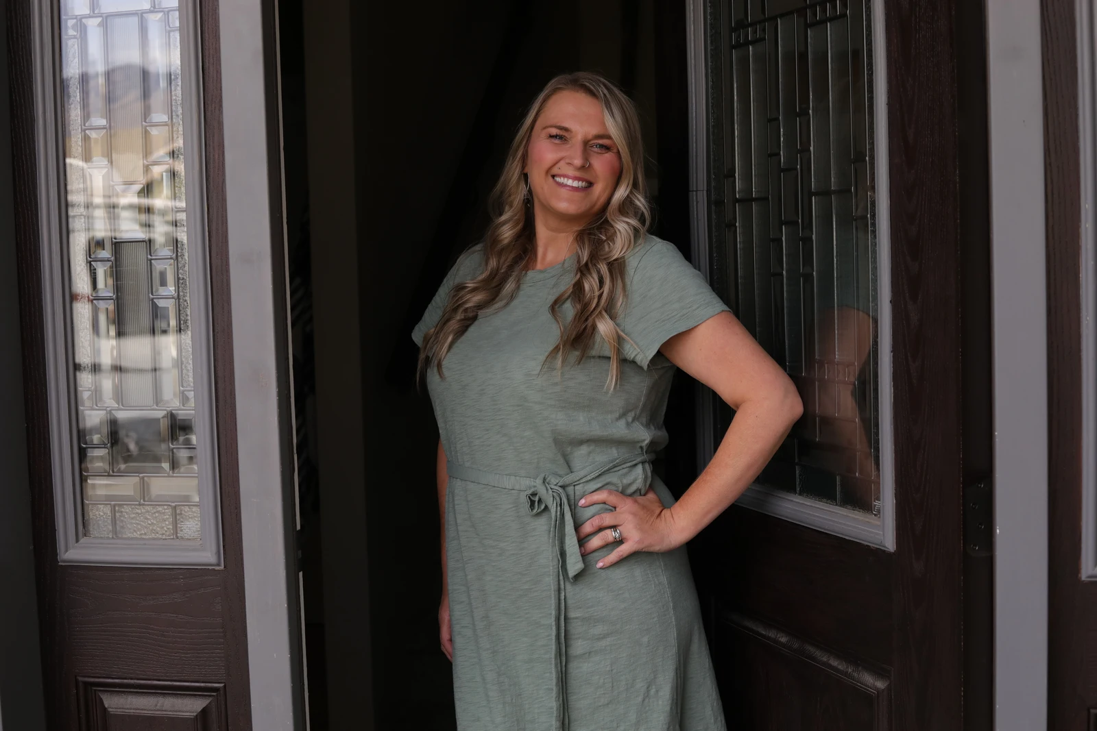 Trisha welcoming visitors at the studio doorway